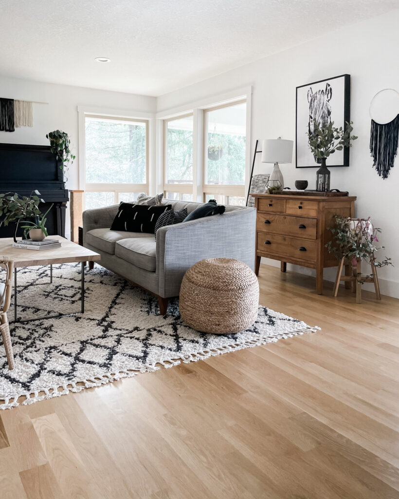 living room with rug, couch, table, and decor