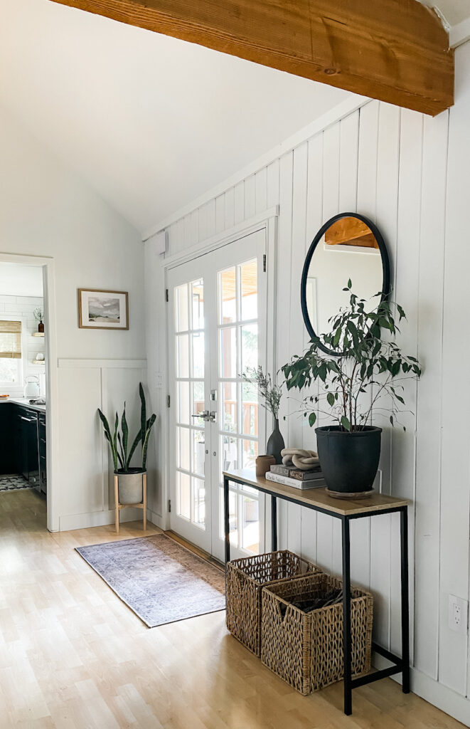 round mirror in entryway